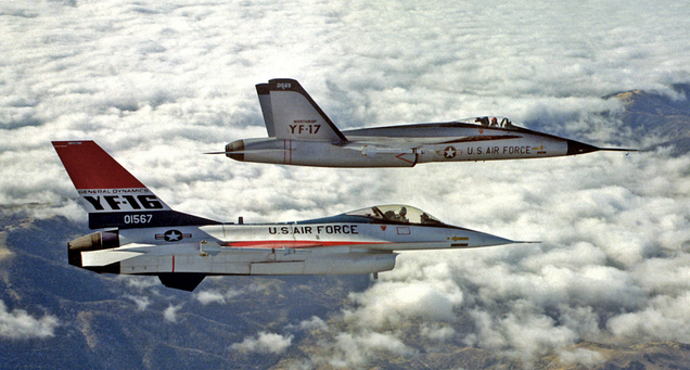 The prototype YF-16 flies in formation with the prototype YF-17 during the competition to select a new lightweight fighter for the US Air Force